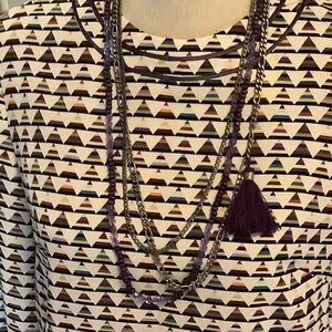 A long Necklace with 2 chains and 1 purple long Beaded one